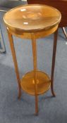 An Edwardian mahogany and inlaid plant stand.