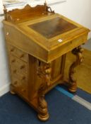 A Victorian walnut Davenport desk.