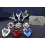 Swarovski Crystal Glass, collection consisting of three coloured tulips on silver stand, three