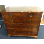 An early 19th century mahogany chest fitted with two short and three long drawers with brass