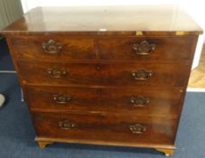 An early 19th century mahogany chest fitted with two short and three long drawers with brass