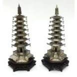 A pair of Chinese silver Pagoda’s possibly by Wang Hing & Company, early 20th century; each composed