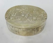 A fine Edward VII silver oval box decorated with traditional scenes,