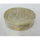 A fine Edward VII silver oval box decorated with traditional scenes,