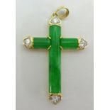 A modern jade and diamond cross set in 18ct yellow gold stamped .750, length 20mm