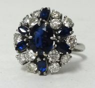 An 18ct white gold sapphire and diamond cluster ring, ring size N1/2