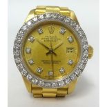 Rolex Date Just, a fine ladies 18ct gold and diamond dot wristwatch with diamond set bezel, with