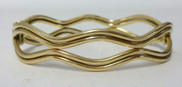 A 9ct yellow gold hinged snap bangle, 13.50gms