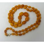 An amber necklace, approx 76.60gm.