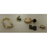 A mixed lot including a 9ct gold dress ring, a 9ct gold onyx set ring, a hardstone pendant