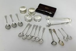 Three silver napkin rings, EP napkin ring, six silver spoons, pair silver spoons, silver button