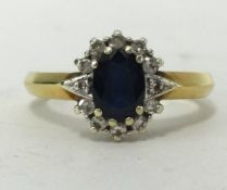 A 9ct gold sapphire and diamond cluster ring.