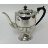 An Edwardian silver coffee pot of Georgian design, with fluted body, Birmingham circa 1903, 21oz.