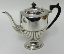An Edwardian silver coffee pot of Georgian design, with fluted body, Birmingham circa 1903, 21oz.