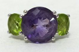 A 14k white gold amethyst and peridot ring, ring size N1/2