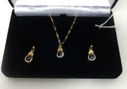 A 9ct amethyst and diamond set pendant and earrings.