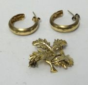 A pair of gold earrings and a brooch, approx 5.6gms.