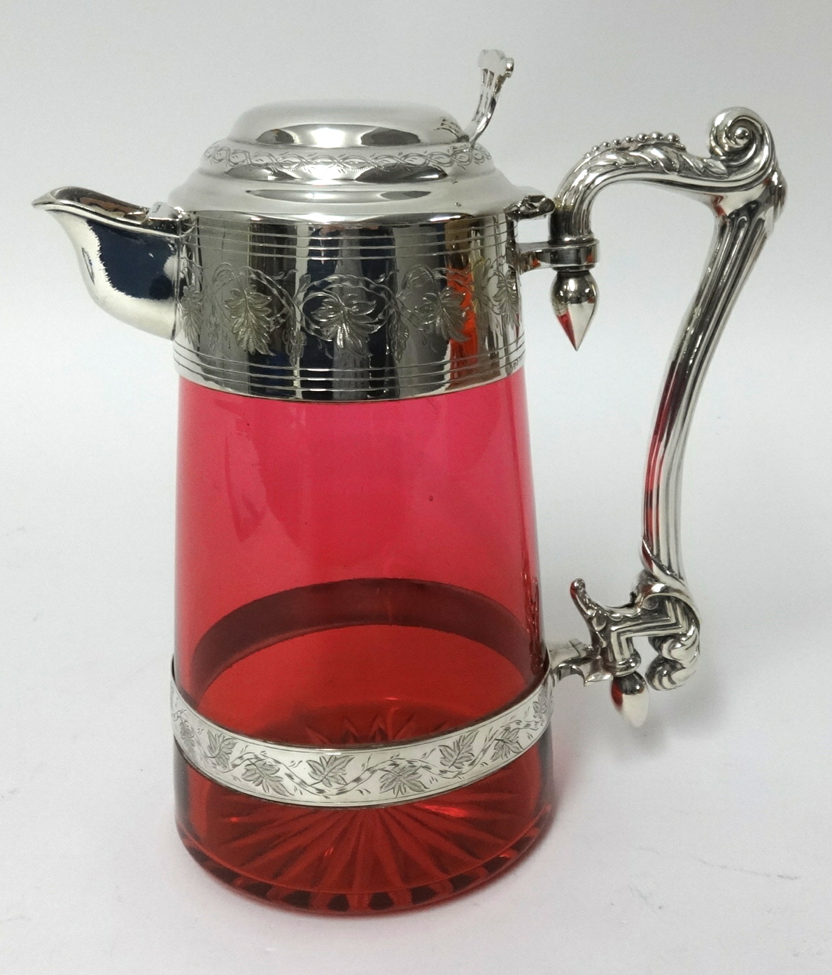 A good Victorian cranberry glass claret jug with plated mounts, stamped WH & S, height 23cm.