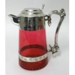 A good Victorian cranberry glass claret jug with plated mounts, stamped WH & S, height 23cm.