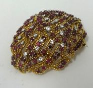 A highly ornate 18ct ruby and diamond brooch, approx 50mm x 39mm.