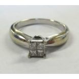 A 14k four stone diamond ring