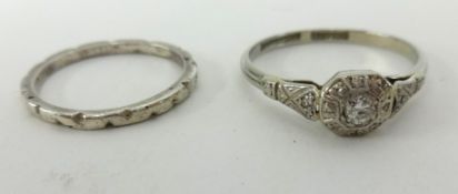 An 18ct white gold and diamond set ring together with an 18ct white gold? wedding band (2).