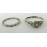 An 18ct white gold and diamond set ring together with an 18ct white gold? wedding band (2).