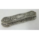 Edwardian silver hat pin box approx 19cm long, with embossed decoration approx 4.10oz.