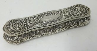 Edwardian silver hat pin box approx 19cm long, with embossed decoration approx 4.10oz.