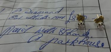 A pair of 18ct diamond ear studs ( with original receipt dated 1983 for £850).