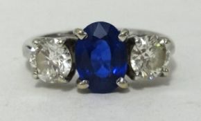 A fine 18ct white gold sapphire and diamond three stone ring, with original receipt dated 2003