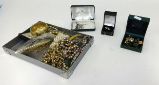 A quantity of various costume jewellery including necklaces, bracelets, bangles, brooches