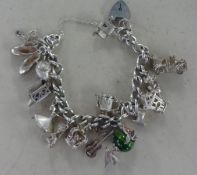 A silver charm bracelet, approx 70gms.