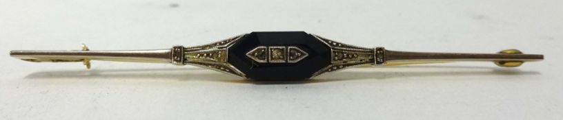 Art Deco style diamond and onyx set brooch in yellow metal