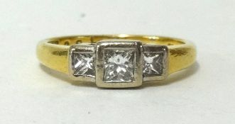 An 18ct diamond three stone ring, ring size J1/2