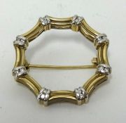 A 9ct diamond set brooch, set with sixteen small round cut diamonds, approx 5.8gms.