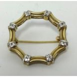 A 9ct diamond set brooch, set with sixteen small round cut diamonds, approx 5.8gms.