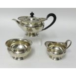 George V three piece silver tea set, Sheffield 1912, H Atkins approx 25oz.
