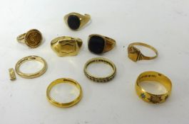 Various gold rings including two 22ct rings (9.10gms), an 18ct band ring (2.60gms), and various