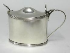 A silver mustard pot, with blue glass liner Birmingham 1930, SB & S Ltd (silver weight 4.67oz).