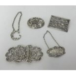 An ornate silver two piece buckle decorated with erns and swags, a rectangular Chinese style brooch,