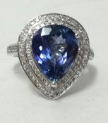 A 14k white gold and diamond ring set with a pear cut tanzanite approx 4.45ct, diamonds approx 0.