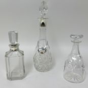 Three glass decanters (two silver mounted).