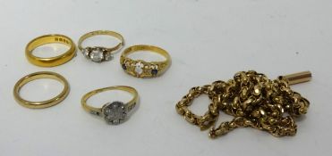 A 22ct gold wedding band (6.30gms), two 18ct dress rings (6.4gms), two 9ct gold rings and a 9ct gold