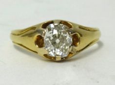 An antique diamond solitaire ring set with a single old cut cushion shaped diamond, weight approx