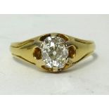 An antique diamond solitaire ring set with a single old cut cushion shaped diamond, weight approx