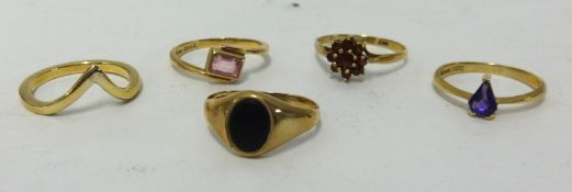 Five assorted gold rings including onyx and gem stone set, approx 9gms.