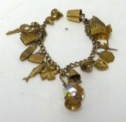 A 9ct gold charm bracelet, approx 34.8gms.