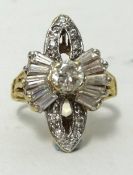 A yellow gold diamond cluster ring, the stylish setting with round and baguette cut diamonds, ring