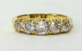An antique 18ct five stone diamond ring set with old cut diamonds, ring size P